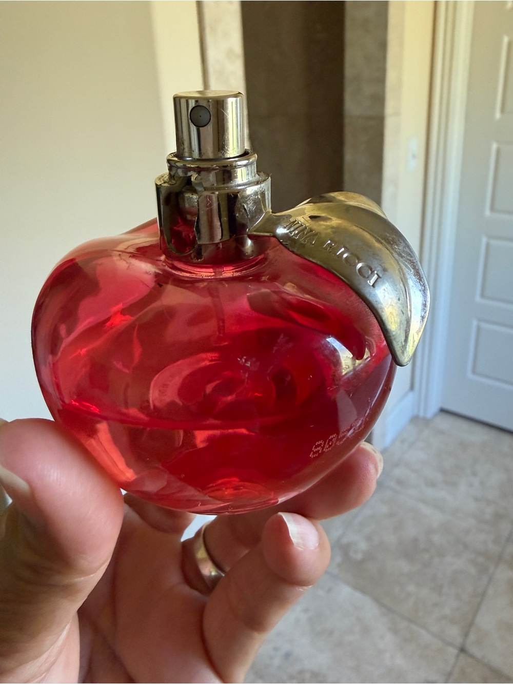 Nina Ricci Red Apple-Shaped Fragrance Bottle with Silver Leaf - Picture 6 of 7